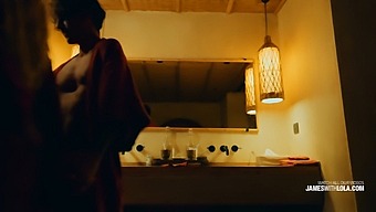 Passionate Love Making By A Romantic Couple In Their Hotel Room